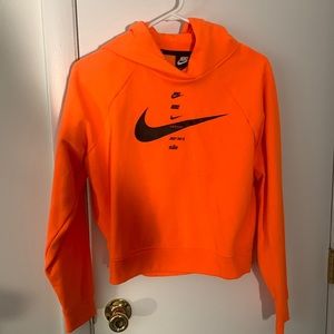 Orange Nike slightly cropped hoodie